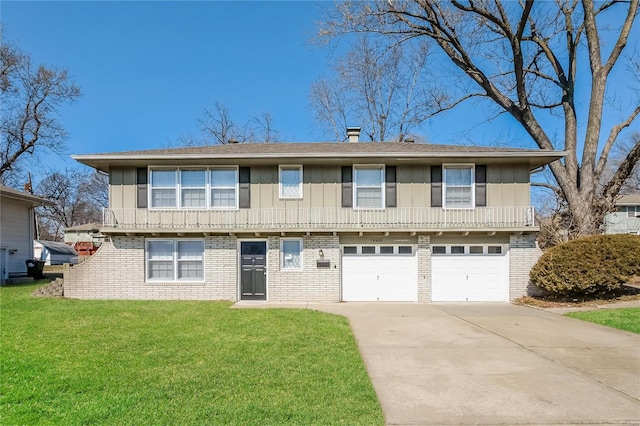 view of front of property with board and batten siding, brick siding, driveway, and a front lawn