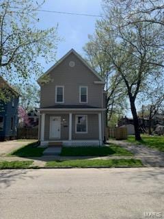 view of front facade featuring covered porch and driveway