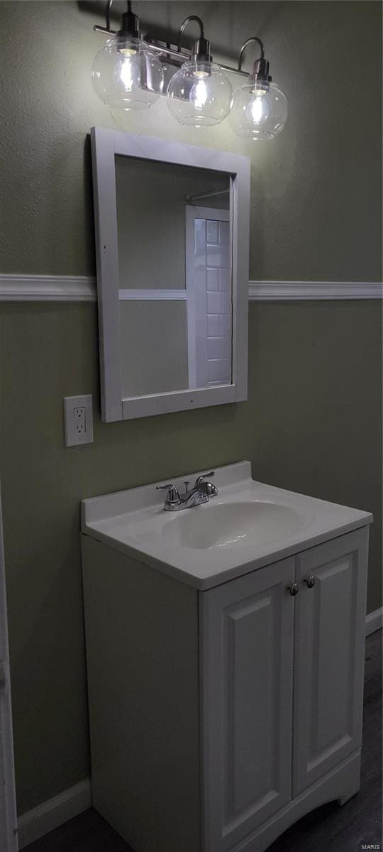bathroom featuring vanity and baseboards
