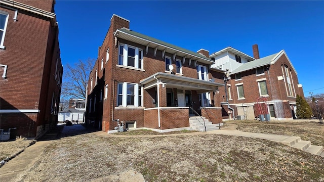 view of front of home with brick siding