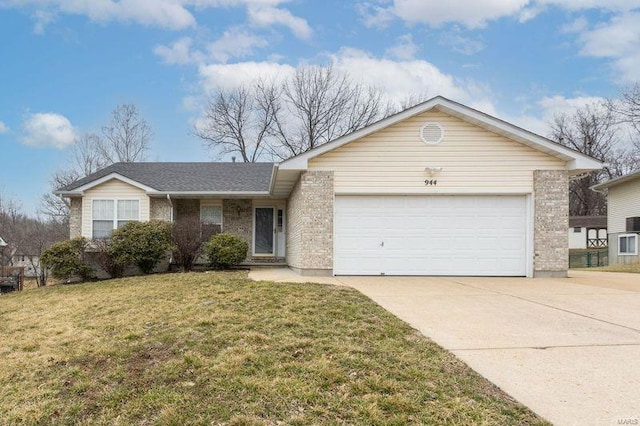 single story home featuring a garage, driveway, a front yard, and brick siding