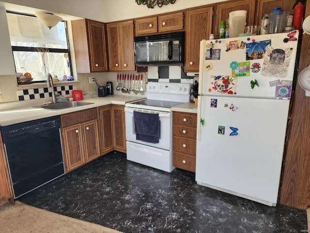 kitchen featuring a sink, light countertops, backsplash, black appliances, and brown cabinetry