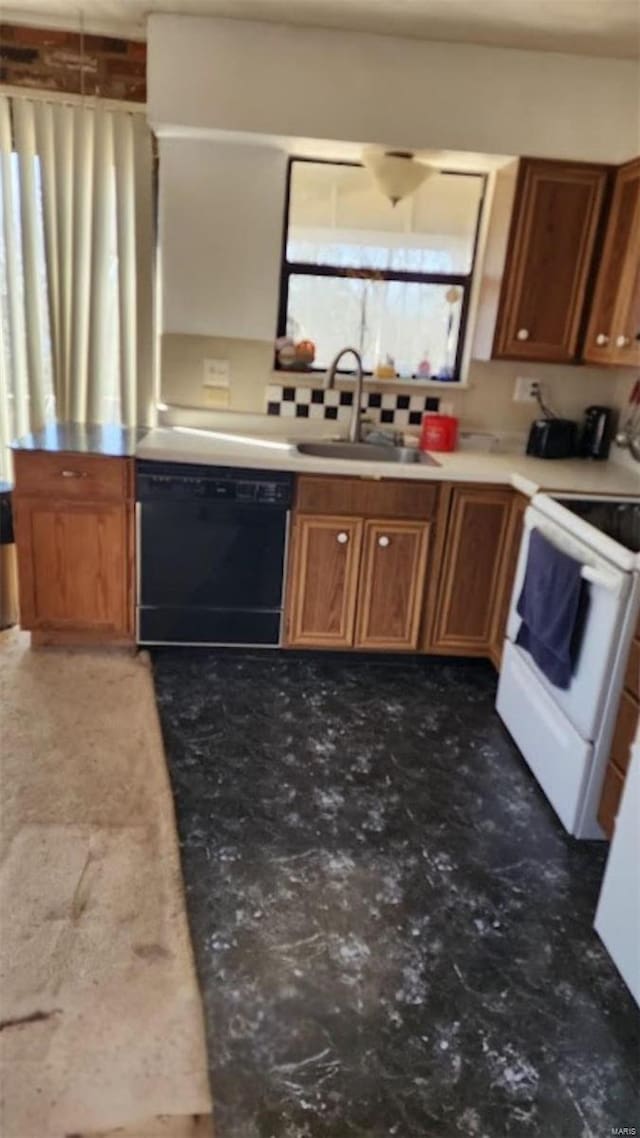 kitchen featuring electric range, a sink, black dishwasher, light countertops, and brown cabinetry