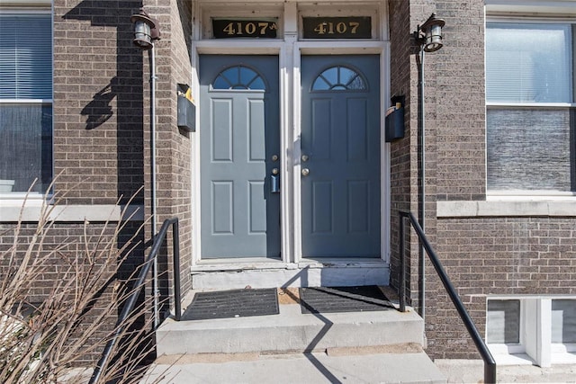 entrance to property with brick siding