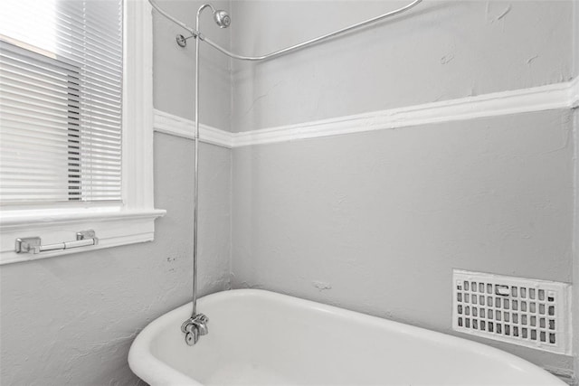 full bathroom with a soaking tub