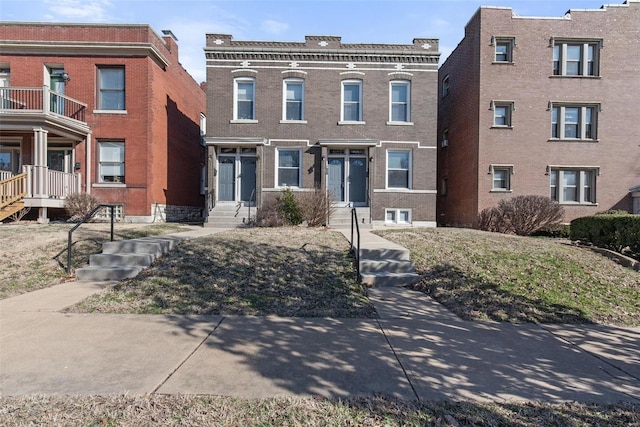 view of front of house featuring brick siding