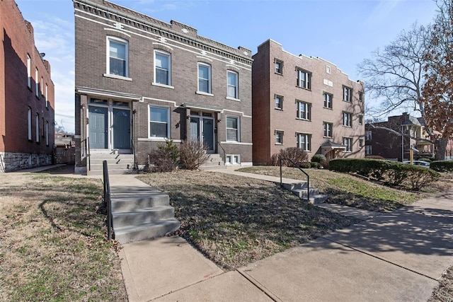 view of front of house featuring brick siding