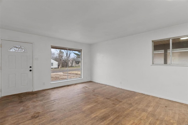 entrance foyer featuring wood finished floors and baseboards