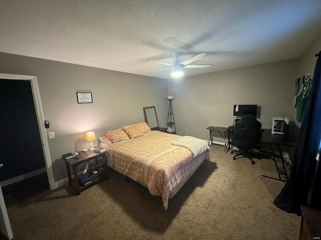 bedroom featuring a textured ceiling, carpet floors, a ceiling fan, and baseboards