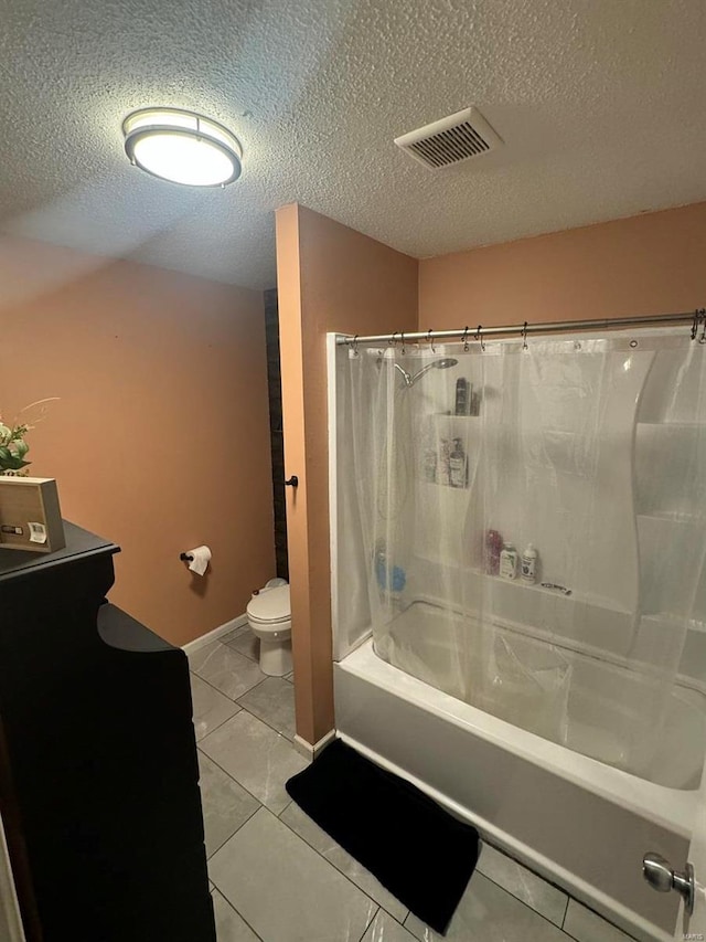 bathroom with shower / bath combo, visible vents, toilet, tile patterned flooring, and a textured ceiling