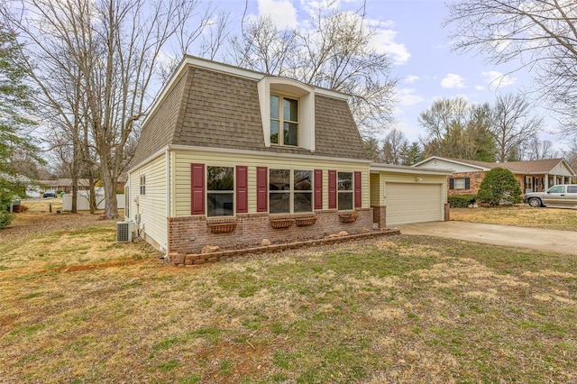 view of front of house featuring a shingled roof, brick siding, and a garage