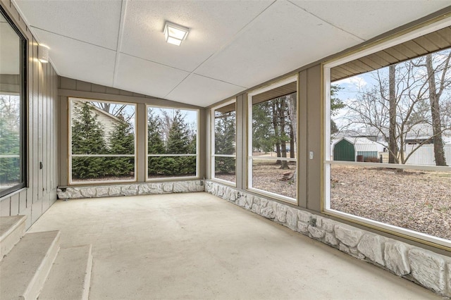 unfurnished sunroom with vaulted ceiling