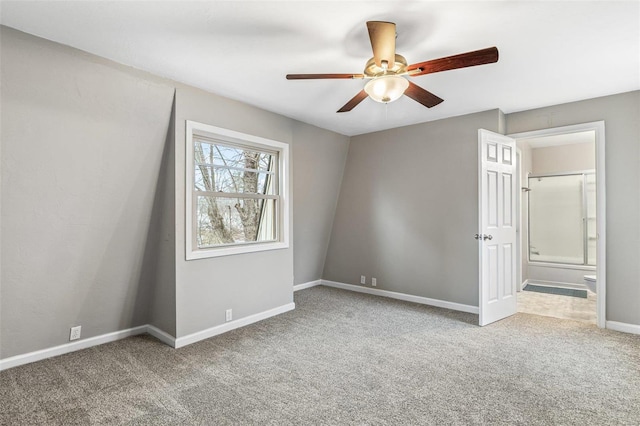 empty room with carpet floors, ceiling fan, and baseboards