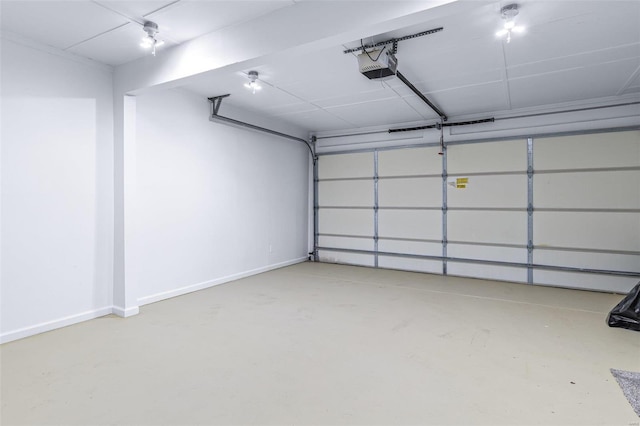 garage featuring baseboards and a garage door opener