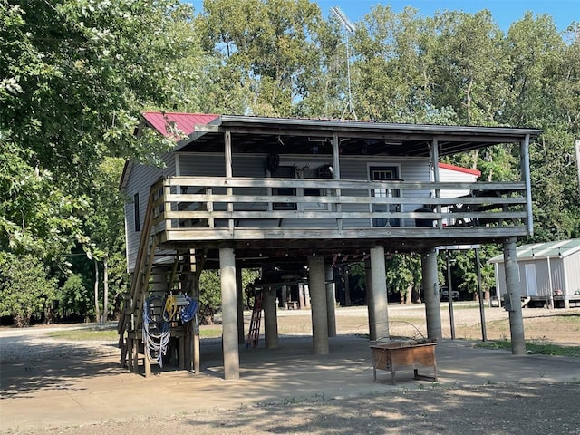 surrounding community featuring a carport and a wooden deck