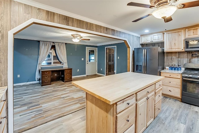 kitchen with light brown cabinets, ornamental molding, gas range oven, stainless steel microwave, and fridge with ice dispenser