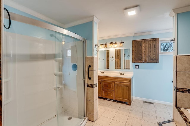 bathroom featuring tile patterned flooring, a sink, a stall shower, and ornamental molding