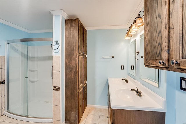 bathroom featuring a sink, a shower stall, and crown molding