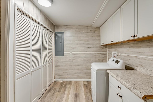 laundry area featuring electric panel, cabinet space, washer hookup, and light wood-style flooring