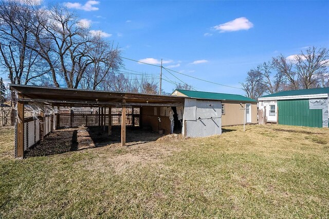 view of outdoor structure featuring a detached carport and an outdoor structure