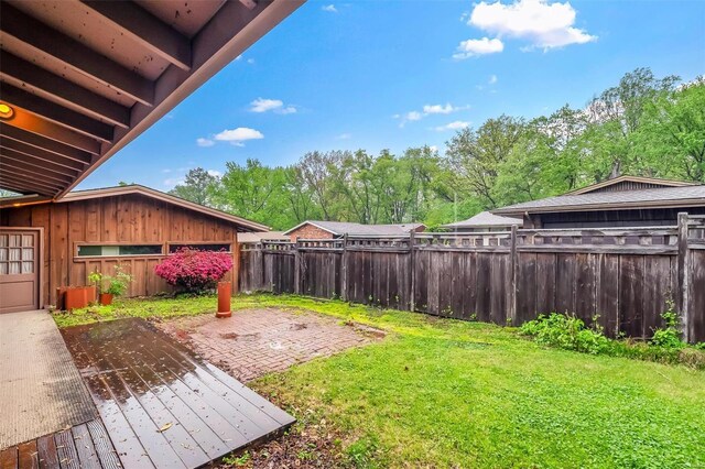 view of yard with a fenced backyard and a patio