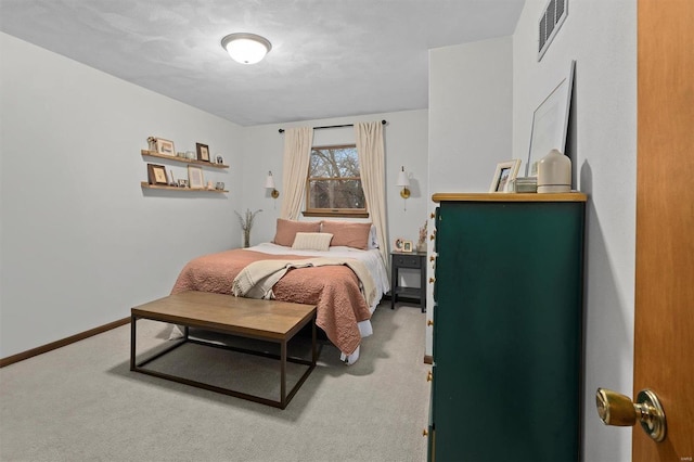 bedroom featuring carpet floors, visible vents, and baseboards