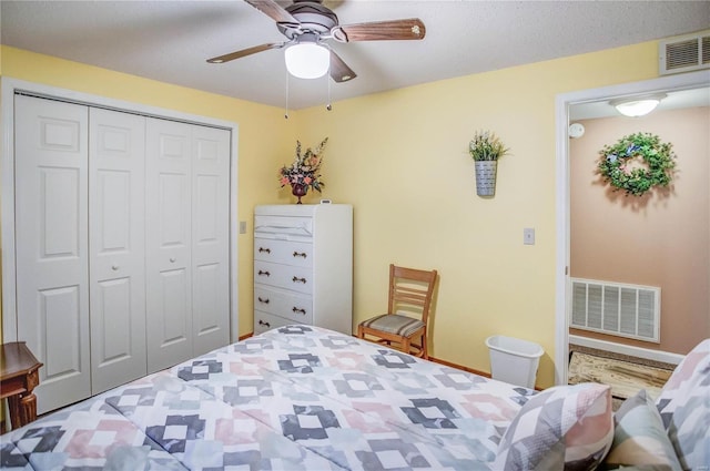 bedroom featuring visible vents, baseboards, a closet, and a ceiling fan