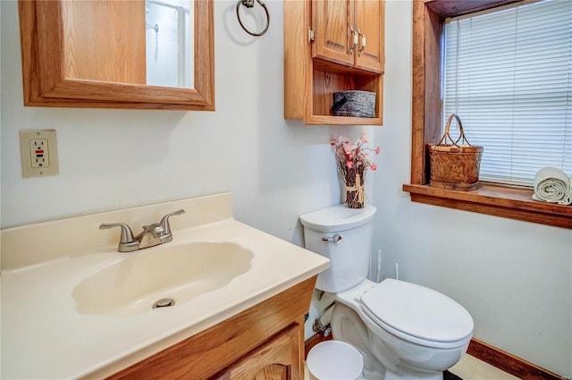 bathroom with toilet and vanity