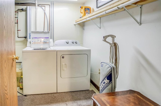 clothes washing area with laundry area and washing machine and clothes dryer