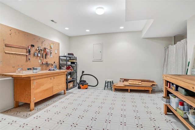 misc room featuring tile patterned floors, visible vents, recessed lighting, and a workshop area