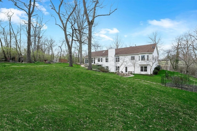 back of property featuring a yard