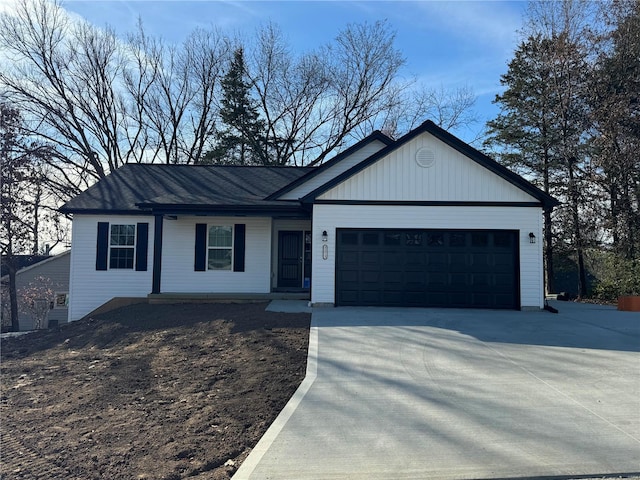 ranch-style home featuring an attached garage and driveway