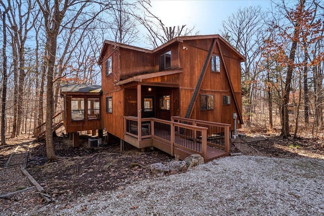 back of house with a sunroom and central air condition unit