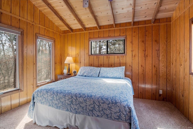 carpeted bedroom featuring wood ceiling, wood walls, and lofted ceiling with beams