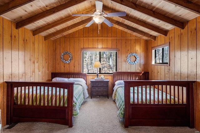 unfurnished bedroom featuring vaulted ceiling with beams, carpet floors, wood walls, and wooden ceiling