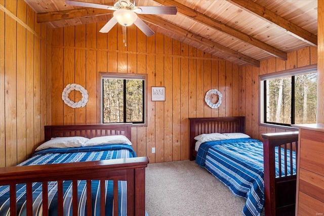 carpeted bedroom with lofted ceiling with beams, wooden ceiling, and multiple windows