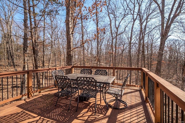 wooden terrace with outdoor dining space