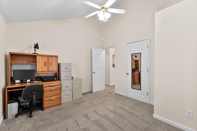 office with high vaulted ceiling, light carpet, ceiling fan, and baseboards