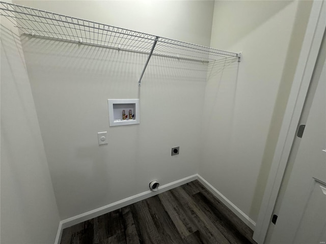 washroom with hookup for a washing machine, dark wood-type flooring, hookup for an electric dryer, laundry area, and baseboards