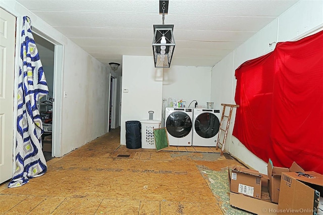 laundry room featuring laundry area and washing machine and clothes dryer