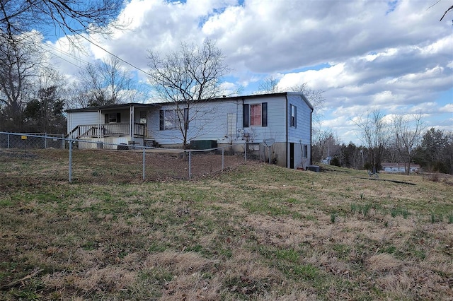 exterior space featuring fence private yard and a front yard