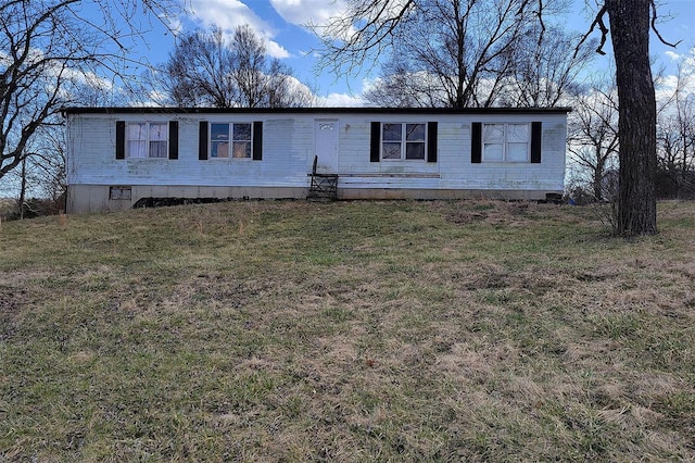 manufactured / mobile home featuring crawl space and a front lawn