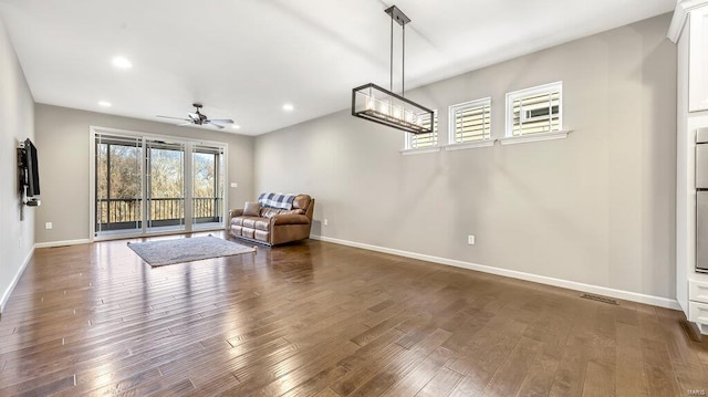 sitting room with visible vents, baseboards, dark wood finished floors, recessed lighting, and a ceiling fan