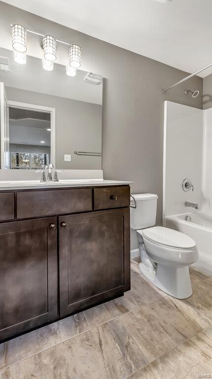 full bath with visible vents, vanity, toilet, and bathing tub / shower combination