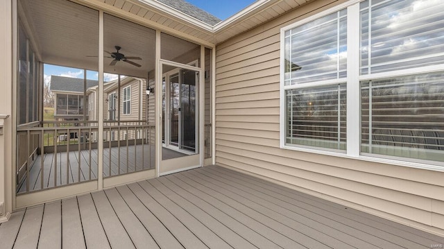 wooden deck with a ceiling fan