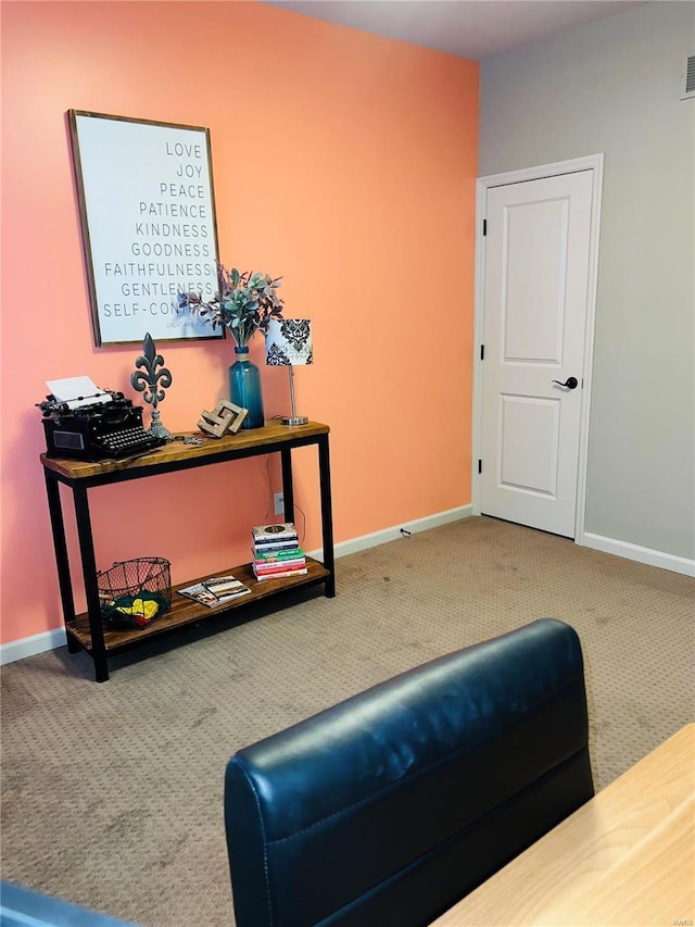 sitting room with visible vents, baseboards, and carpet