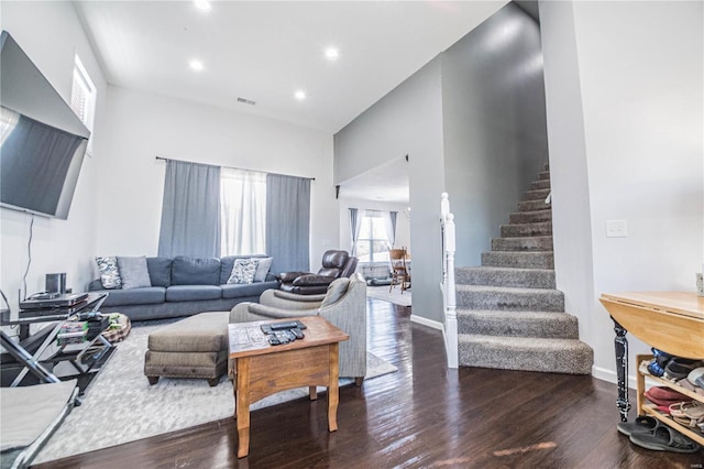 living area featuring stairs, visible vents, wood finished floors, and recessed lighting