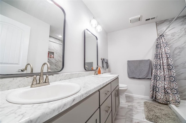 bathroom featuring toilet, marble finish floor, visible vents, and a sink