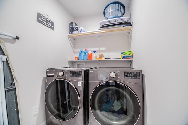 clothes washing area featuring laundry area and independent washer and dryer