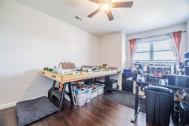 office with a ceiling fan, visible vents, and wood finished floors